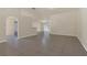 Open-concept living space features tile flooring, neutral walls, and ample natural light, perfect for entertaining at 806 Rocky Mountain Ct, Valrico, FL 33594