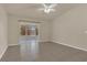 Open living area featuring sliding glass doors leading to a screened in porch, and tile flooring throughout at 806 Rocky Mountain Ct, Valrico, FL 33594