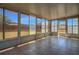 Sunroom with tiled floor and multiple windows providing ample natural light and views at 806 Rocky Mountain Ct, Valrico, FL 33594