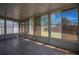 Enclosed sunroom with tiled flooring, offering a bright and airy additional living space at 806 Rocky Mountain Ct, Valrico, FL 33594