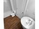 Bathroom with white fixtures including a pedestal sink, toilet and tub shower combination at 10768 Carloway Hills Dr, Wimauma, FL 33598