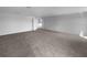 Large bonus room provides ample space for entertainment or recreation with neutral carpet at 10768 Carloway Hills Dr, Wimauma, FL 33598