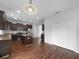 Well-equipped kitchen boasts stainless steel appliances, granite counters, and a central island for meal preparation at 10768 Carloway Hills Dr, Wimauma, FL 33598