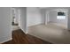 Spacious living room features neutral carpet and flows into dining area, perfect for entertaining at 10768 Carloway Hills Dr, Wimauma, FL 33598