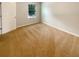 Bedroom with neutral carpet, white walls, and a window providing natural light at 5383 Magdalene Way, Zephyrhills, FL 33541