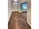 Inviting entryway featuring wood-look flooring leading into the home's main living area at 5383 Magdalene Way, Zephyrhills, FL 33541