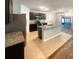 Stylish kitchen with stainless steel appliances, granite countertops, and a central island perfect for entertaining at 5383 Magdalene Way, Zephyrhills, FL 33541