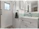 Bathroom featuring white vanity, and mosaic tile backsplash at 5651 Kelly N Dr, St Petersburg, FL 33703