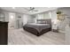 Spacious bedroom featuring a ceiling fan, large window, and walk in closet at 5651 Kelly N Dr, St Petersburg, FL 33703