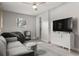 Relaxing bonus room featuring modern furniture, hardwood flooring, and bright lighting at 5651 Kelly N Dr, St Petersburg, FL 33703