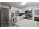 Bright, updated kitchen featuring stainless steel appliances and ample counter space at 5651 Kelly N Dr, St Petersburg, FL 33703