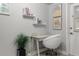 Bright office space with floating shelves, modern desk, and decor at 5651 Kelly N Dr, St Petersburg, FL 33703