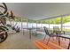 Enclosed patio with ping pong table and colorful rug, offering a relaxing and recreational space at 5651 Kelly N Dr, St Petersburg, FL 33703