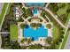 Stunning aerial view of the resort-style pool with lush landscaping and luxurious amenities at 2532 Avolet Ct, Lakewood Ranch, FL 34211