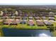 Aerial view of homes bordering a lake at 2532 Avolet Ct, Lakewood Ranch, FL 34211