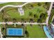 Aerial view of the community tennis court, green spaces, and winding walkways at 2532 Avolet Ct, Lakewood Ranch, FL 34211