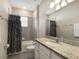 Functional bathroom design, featuring vanity with granite countertop, and combination tub-shower at 2532 Avolet Ct, Lakewood Ranch, FL 34211