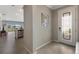 View of a foyer featuring tile floors, a mirror, and a decorative front door at 2532 Avolet Ct, Lakewood Ranch, FL 34211