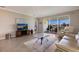 Comfortable living room with sliding glass doors and views of the backyard at 2532 Avolet Ct, Lakewood Ranch, FL 34211