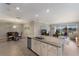 An open floor plan joins the kitchen, dining area, and living room, offering great views of the backyard at 2532 Avolet Ct, Lakewood Ranch, FL 34211