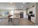 An open floor plan joins the kitchen and living room, maximizing space and light at 2532 Avolet Ct, Lakewood Ranch, FL 34211