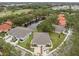 An aerial view of the community with water feature, landscaping, and residences with driveways at 146 51St Street E Cir, Palmetto, FL 34221