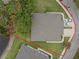 Aerial view shows the property and the surrounding landscape including trees and lawn at 146 51St Street E Cir, Palmetto, FL 34221