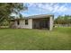 Manicured lawn and screened in patio provide a tranquil outdoor space at 146 51St Street E Cir, Palmetto, FL 34221