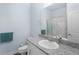 Bathroom with white vanity, granite countertop, and shower at 146 51St Street E Cir, Palmetto, FL 34221