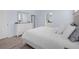 Bedroom with large bed, white dresser, and ensuite bathroom at 146 51St Street E Cir, Palmetto, FL 34221