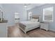 Light filled bedroom with white furniture and a ensuite bathroom with granite countertops at 146 51St Street E Cir, Palmetto, FL 34221