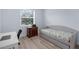 Bedroom with large window, desk, and pull-out bed at 146 51St Street E Cir, Palmetto, FL 34221