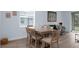 Dining area featuring a wood table, seating for six, and wood flooring at 146 51St Street E Cir, Palmetto, FL 34221