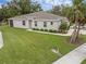 Charming single-story home with a well-manicured lawn and lovely landscaping at 146 51St Street E Cir, Palmetto, FL 34221