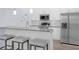 Modern kitchen featuring stainless steel appliances, a granite countertop, and bar stool seating at 146 51St Street E Cir, Palmetto, FL 34221