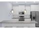 Modern kitchen featuring stainless steel appliances, granite countertops, and subway tile backsplash at 146 51St Street E Cir, Palmetto, FL 34221