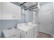 Laundry room with washer, dryer, sink, and lots of cabinet space at 146 51St Street E Cir, Palmetto, FL 34221