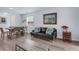 Bright living room featuring an open floor plan with laminate floors and neutral paint at 146 51St Street E Cir, Palmetto, FL 34221