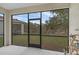 View of the serene lake and backyard from the screened-in patio, ideal for outdoor living at 146 51St Street E Cir, Palmetto, FL 34221