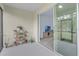 Cozy screened in patio with potted plants, sliding glass door opens into the living room with TV at 146 51St Street E Cir, Palmetto, FL 34221