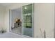 Indoor/outdoor living, showcasing sliding glass doors open from the screened-in lanai to the living room at 146 51St Street E Cir, Palmetto, FL 34221