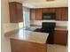 Cozy kitchen featuring stainless steel appliances, granite counters, and ample storage space at 3347 Roxbury Dr, Holiday, FL 34691