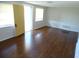 Bright living room featuring hardwood floors, natural light, and a welcoming entrance at 3347 Roxbury Dr, Holiday, FL 34691