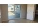 Bright sun room featuring tile floors, sliding glass doors to the backyard, and lots of natural light at 3347 Roxbury Dr, Holiday, FL 34691