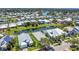Beautiful aerial view of waterfront homes with manicured lawns and mature palm trees at 530 Bimini Bay Blvd, Apollo Beach, FL 33572