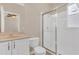 Bathroom featuring a glass shower, a sink and toilet set, and modern decor at 530 Bimini Bay Blvd, Apollo Beach, FL 33572