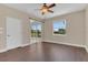 Bedroom with a ceiling fan, laminate floors, and sliding glass doors that provides lots of light at 530 Bimini Bay Blvd, Apollo Beach, FL 33572