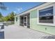 Rear of house with wooden deck and screened lanai, providing seamless indoor-outdoor living at 530 Bimini Bay Blvd, Apollo Beach, FL 33572