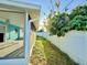 View of the yard, bordering the screened-in patio at 2302 16 W St, Palmetto, FL 34221
