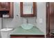 Chic bathroom features an elegant glass bowl sink and dark wood cabinets at 2302 16 W St, Palmetto, FL 34221
